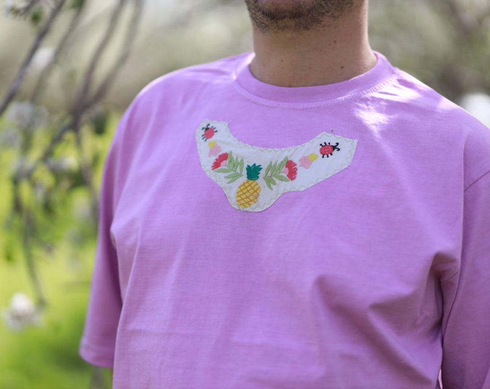 Sustainable coral Pink cotton tee, oversized fit, unisex, featuring handmade upcycled patchwork.